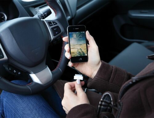 Drivers who are caught fiddling with their smartphone charging cables will have to pay a fine
